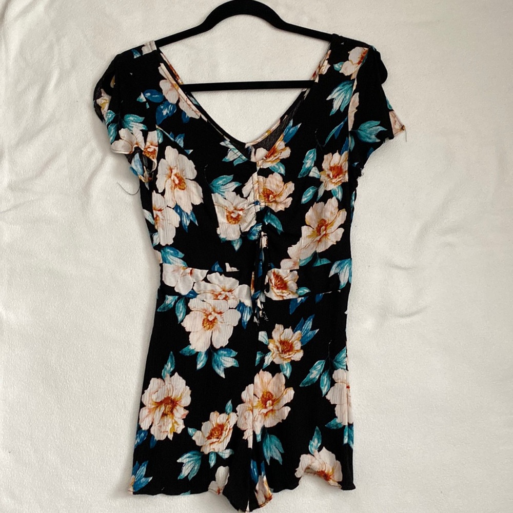 Floral Romper with small opening and tie in the front